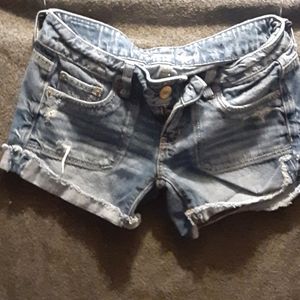 Low rise medium wash cutoff shorts